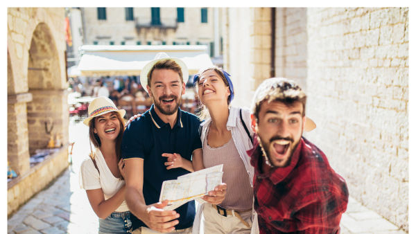 Leader in a group travel group holding a map