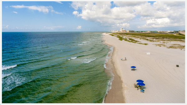 Orange beach coast line with people