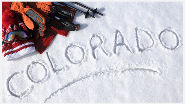 Top down photo of the word Colorado etched in snow