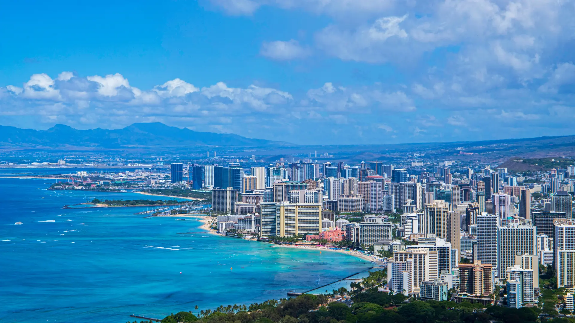 Aerial view of Honolulu showcasing its skyscrapers and beaches