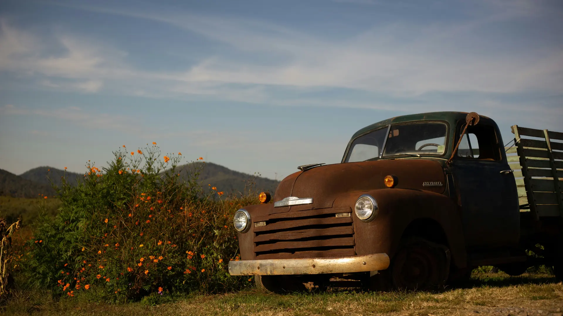 Old truck in the foreground of the Blue Ridge mountains