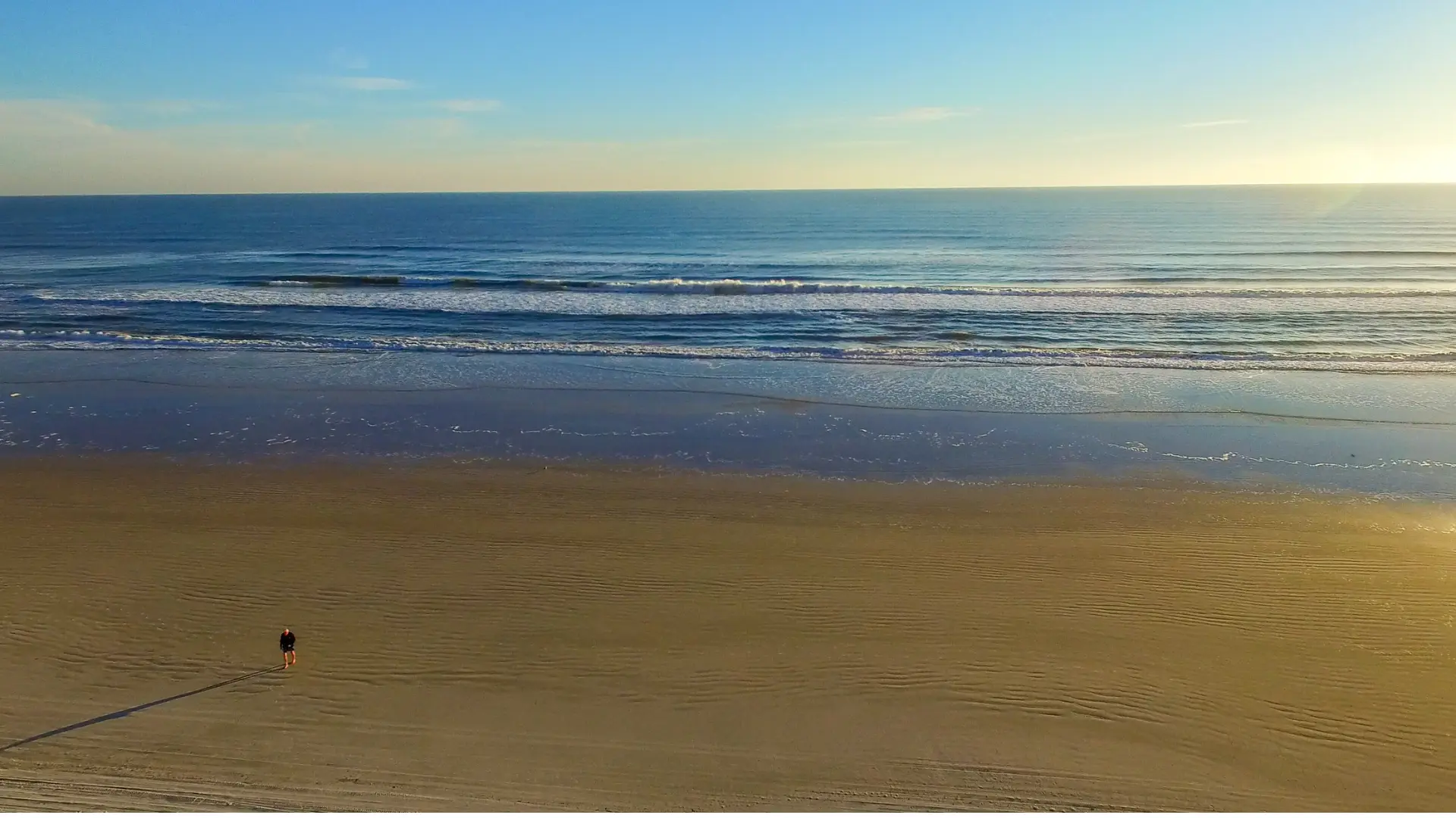 Aerial view Florida beach with a man walking