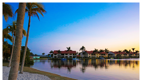 Image of waterfront and condos at sunset in Cape Coral