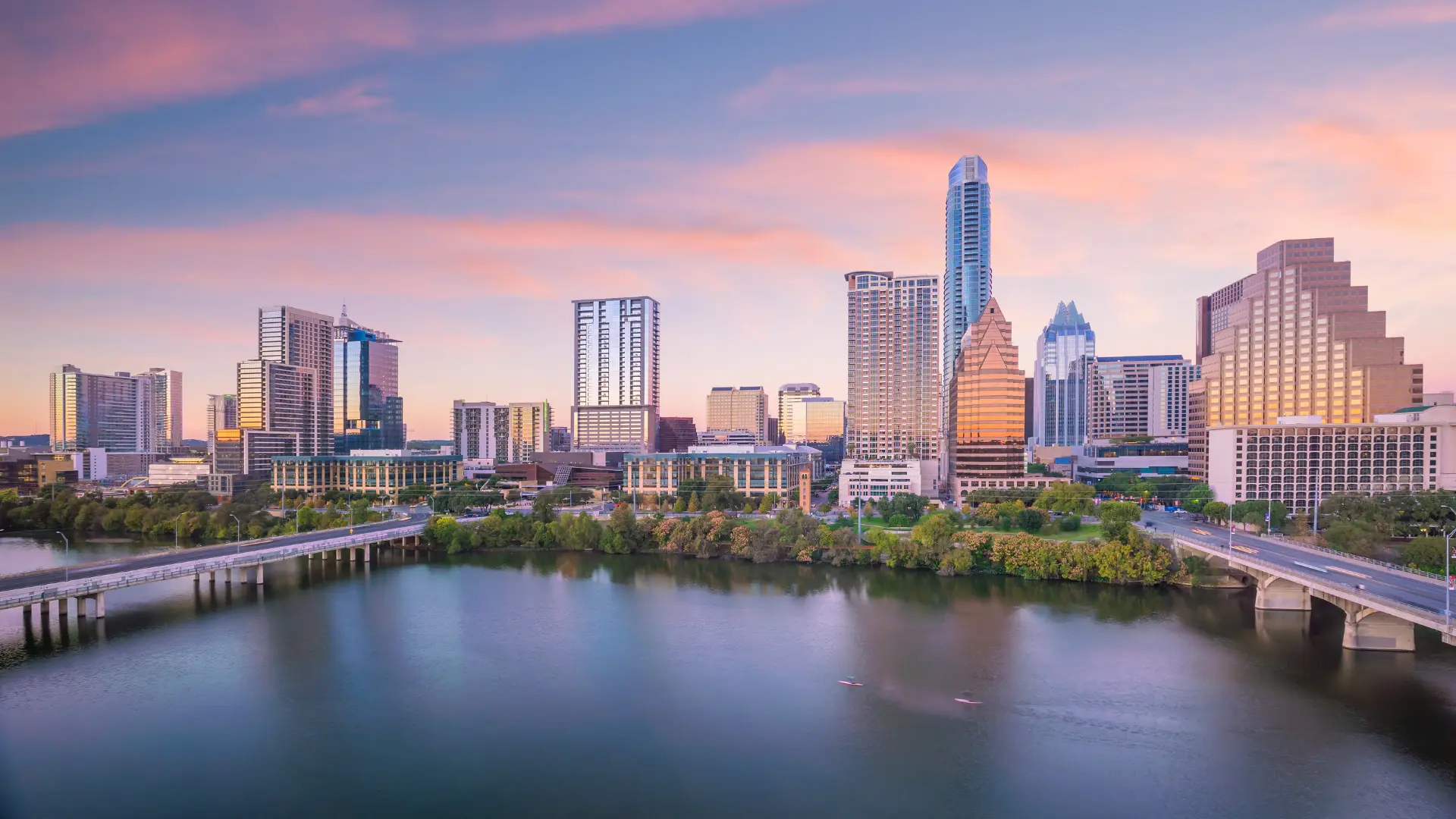 Downtown skyline of Austin Texas with a pink and purple sunset