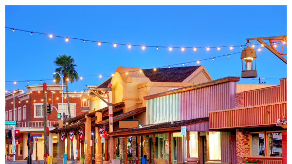 VIew of the old town part of Scottsdale, AZ at night with string lights