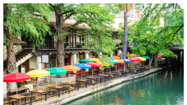 View of San Antonio river walk with colorful umbrellas along the walkway