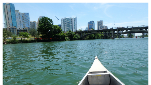 View of downtown Austin on lady Bird Lake by canoe