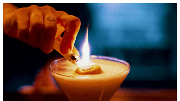 Image of cocktail being lit on fire at the Rabbit Hole