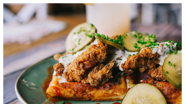 View of a mac n cheese chicken and waffle dish from Tupelo Honey