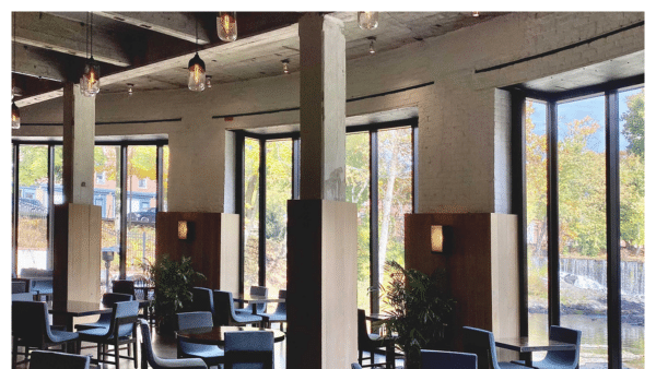 View of the Rounhouse restaurant dining room with view of falls