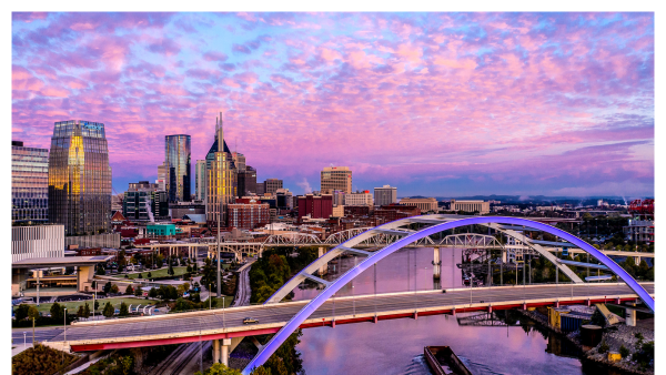 Aerial view of downtown Nashville and a purple sunset