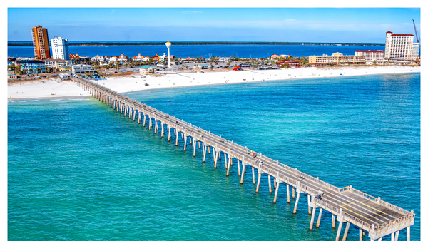 Aerial view of the Pensacola Beach pier and blue waters