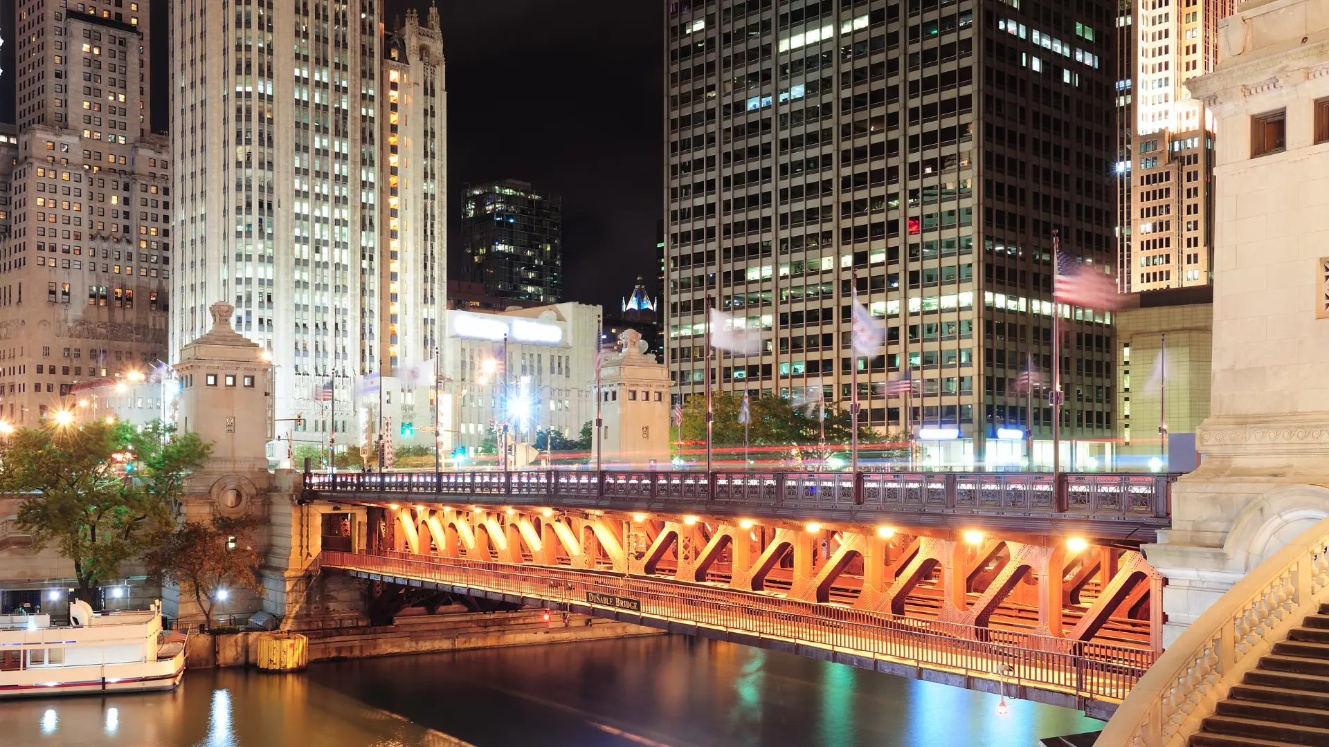 View of a bridge over the Chicago riverwalk at night