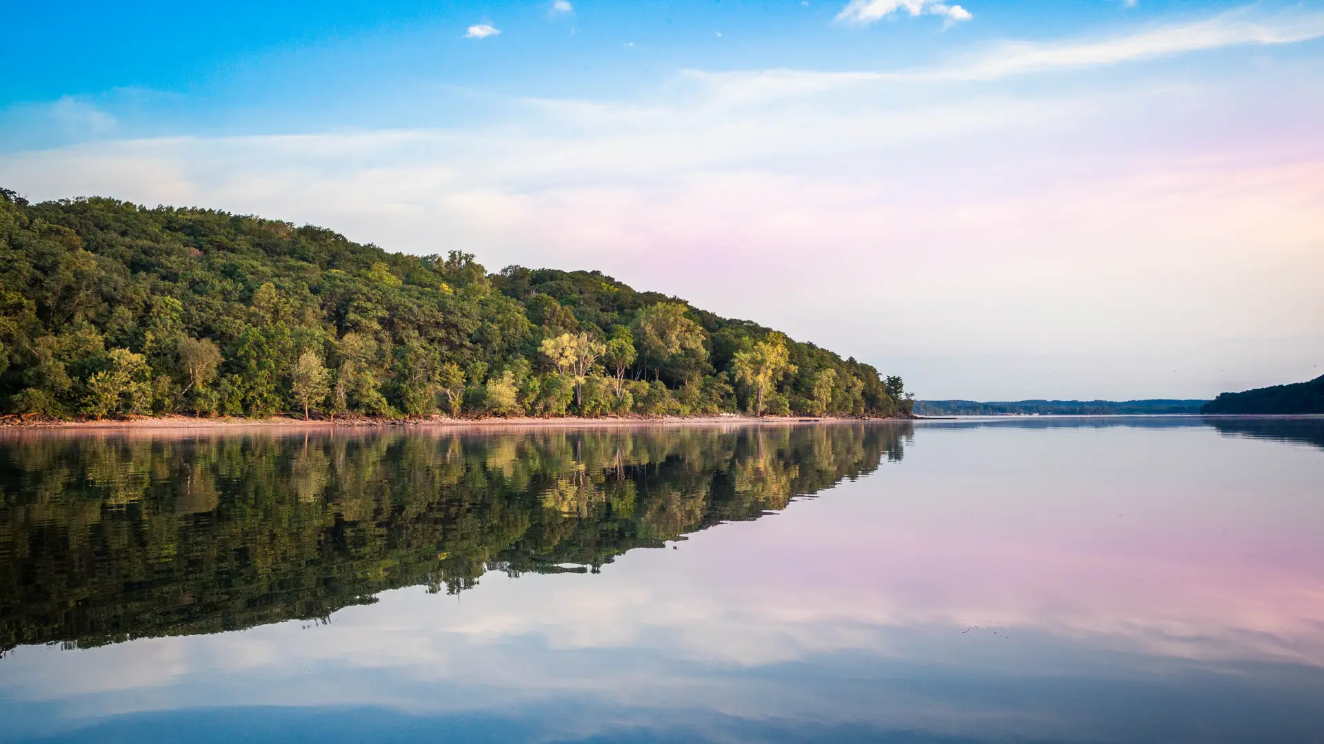 View of a lake and lush green woods in Wisconsin