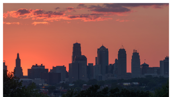 View of dark Kansas City skyline with an orange sunset