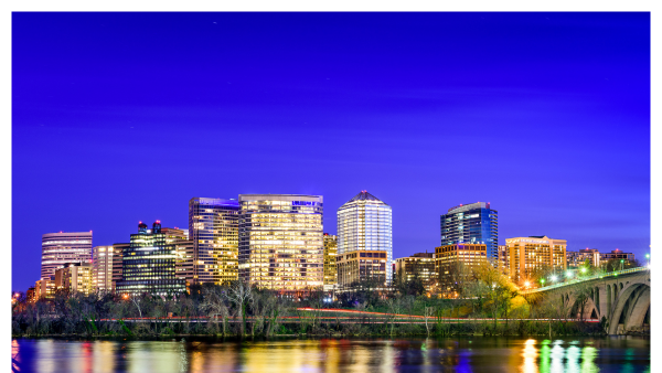 View of the Arlington skyline at night along the Potomac River