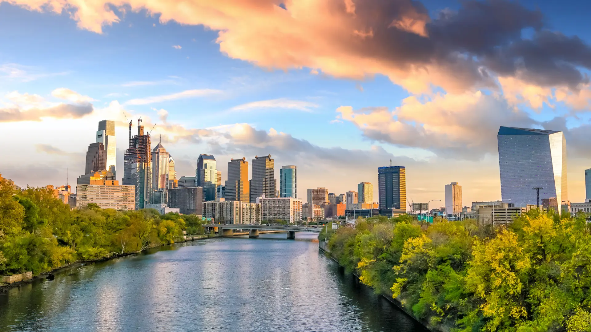 View of the Philly skyline at sunset by the river close by