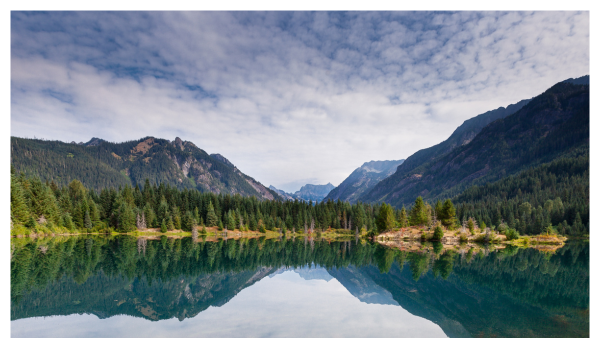 View of the Snoqualmie Pass by water on a cloudy day