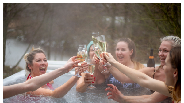 View of women doing a cheers in a Hot tub