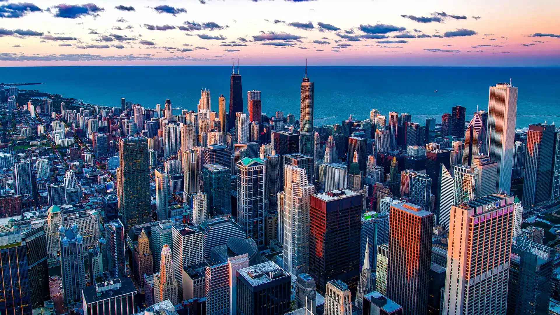 View of the Chicago city skyline at sunset with tall buildings